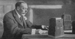 Black and white image of a vintage radio announcer broadcasting at the BBC.