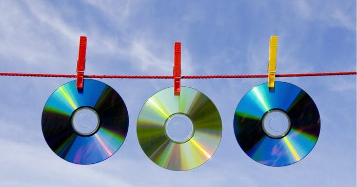 CD, DVD discs hanging out to dry as if having been cleaned.
