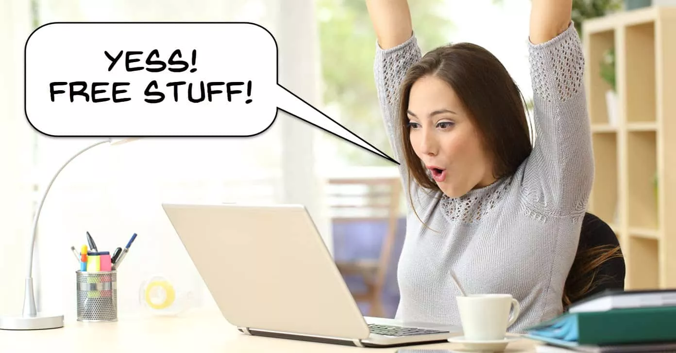 Woman at a computer excited to receive free stuff.