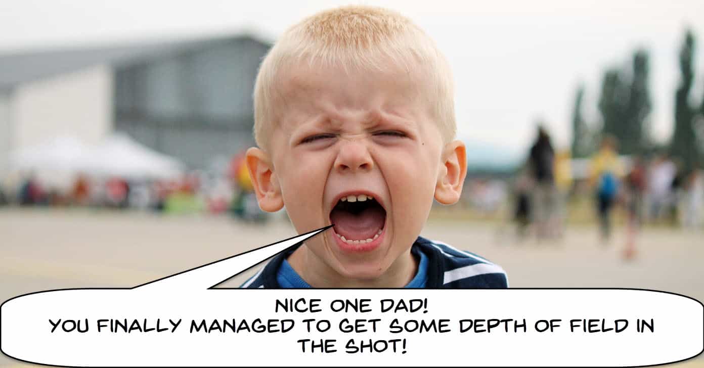 Humorous image of a boy yelling at father about depth of field in video.