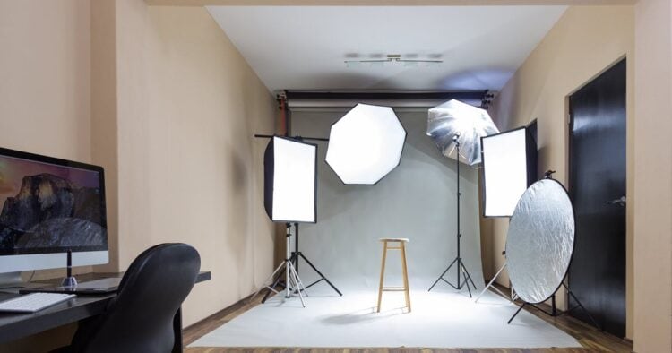 Studio setup with various types of lights for video recording.