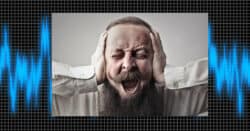 Image of a man drowned out by background noise.