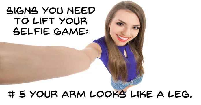 Woman taking a a bad selfie due to her arm looking distorted.