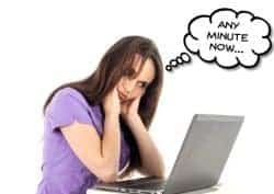 Top image of girl waiting for a slow computer.