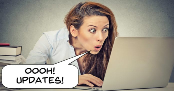 Image of woman looking at computer excited about software updates.