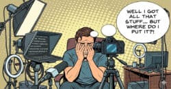 Guy sitting in a disorganized space with video equipment.