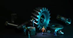 Image representing imaginary workers performing maintenance on a computer.