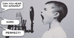Boy singing badly into a microphone.
